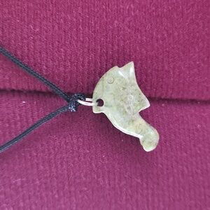 Unisex green carved dolphin pendant on adjustable silk cord